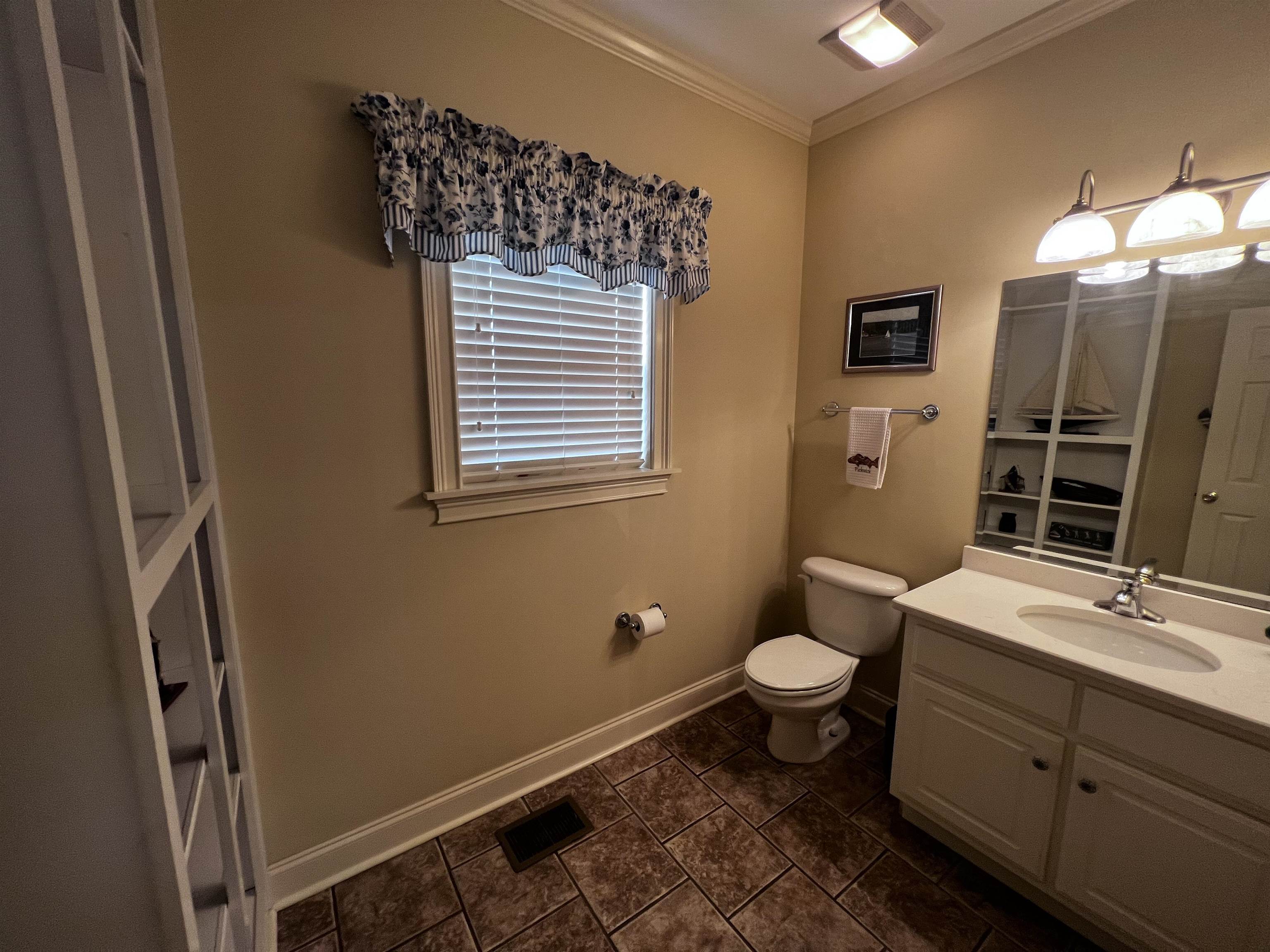 16 Jennifer Junction Iuka, MS 38852 - Photo 18 of 36 a bathroom with a toilet sink and mirror
