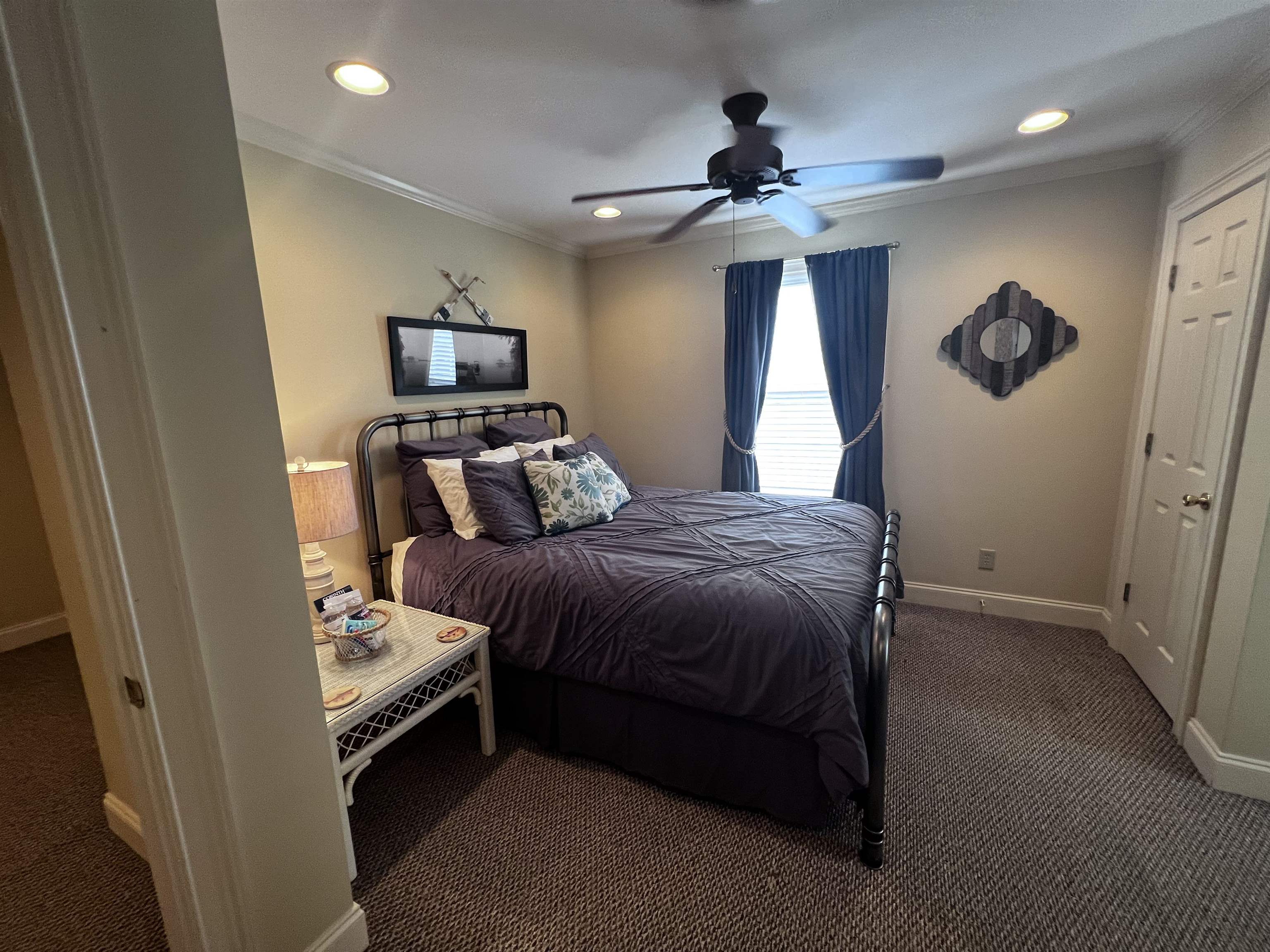 16 Jennifer Junction Iuka, MS 38852 - Photo 20 of 36 a bedroom with a bed and a chandelier