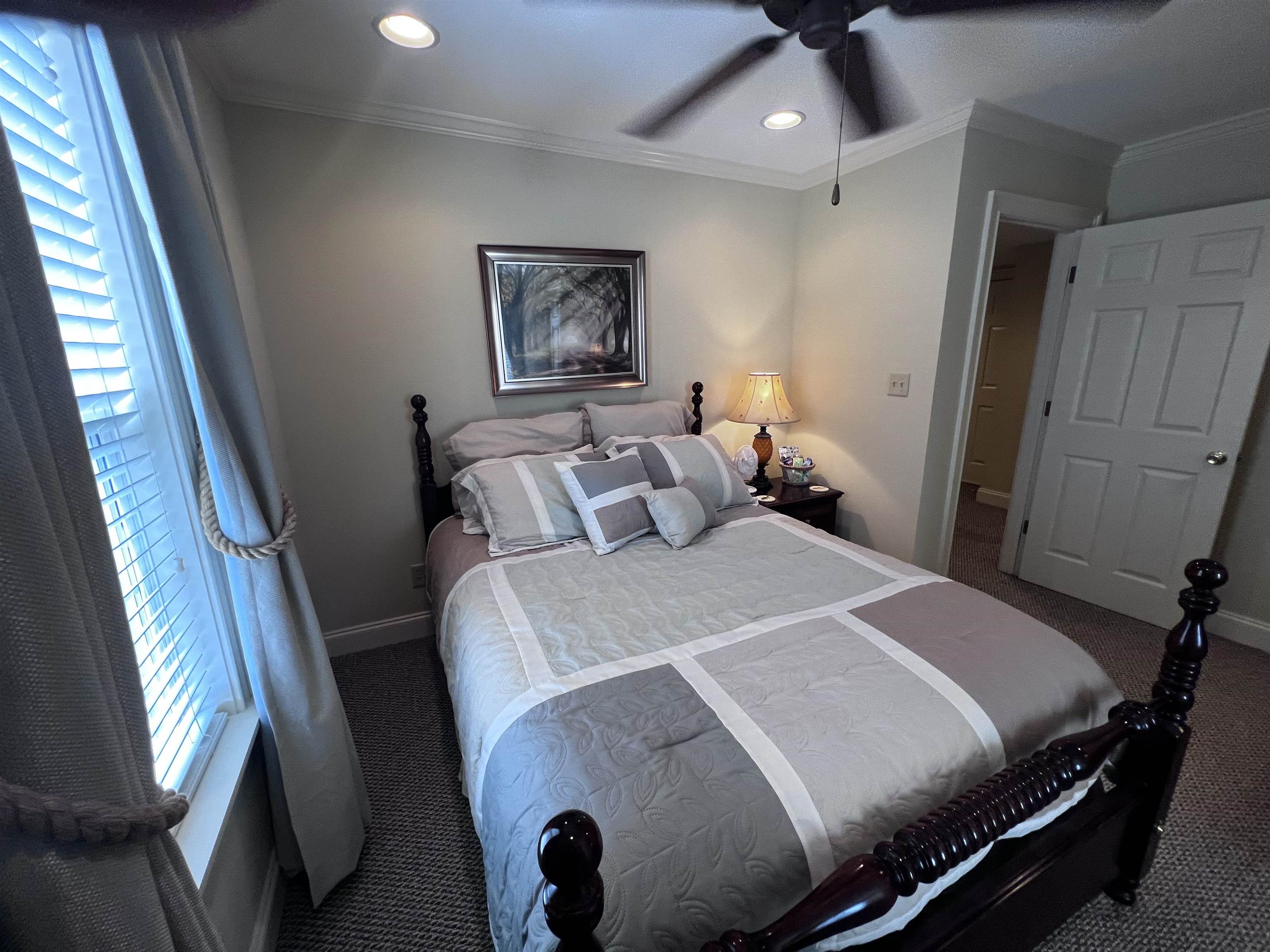 16 Jennifer Junction Iuka, MS 38852 - Photo 27 of 36 a bedroom with a bed and wooden floor