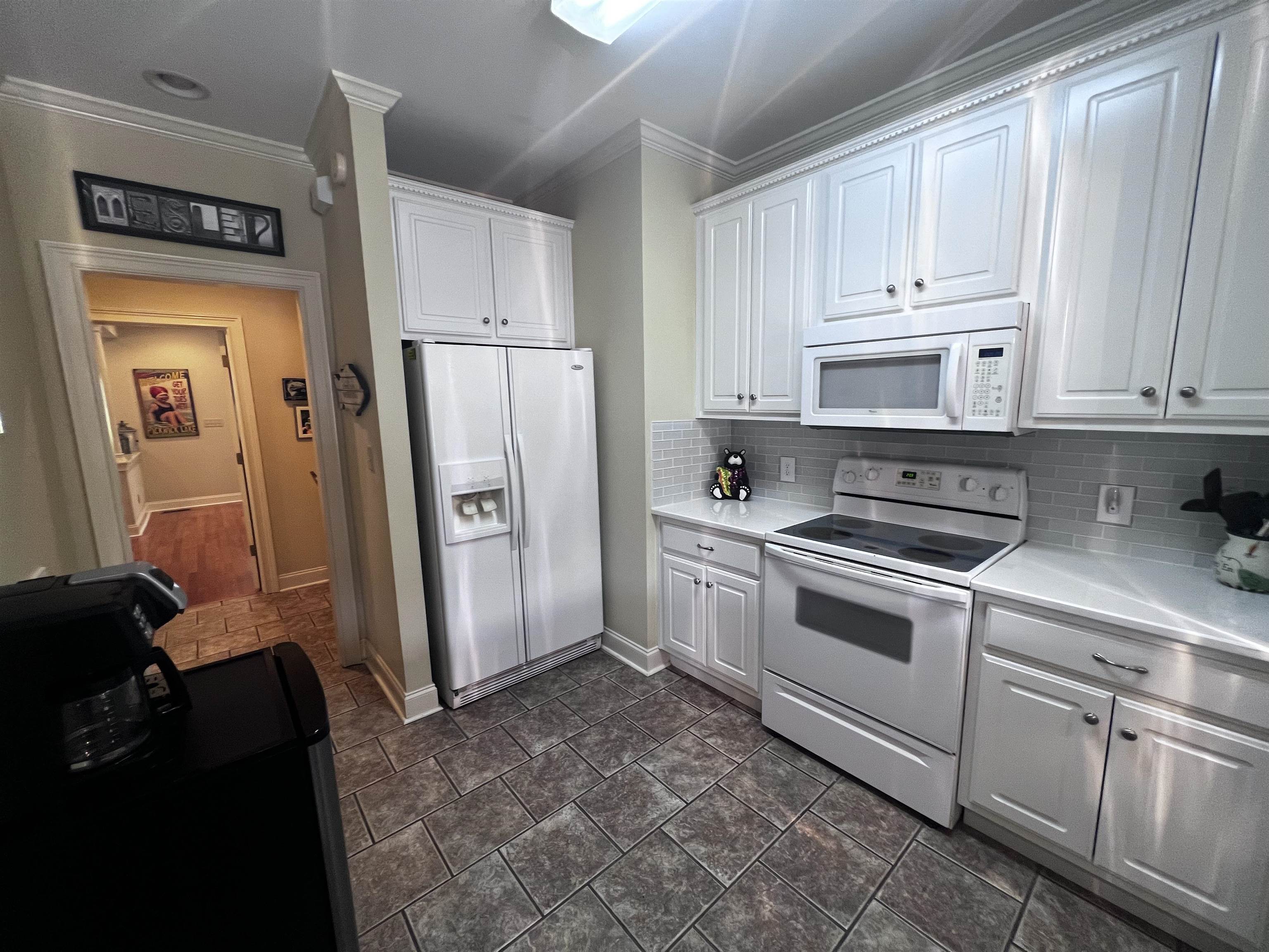 16 Jennifer Junction Iuka, MS 38852 - Photo 10 of 36 a kitchen with white cabinets and refrigerator