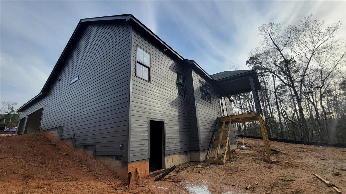 533 16th Circle Walhalla, SC 29691 - Photo 3 of 28 This new construction features modern exterior finishes, with a spacious porch and attached garage.