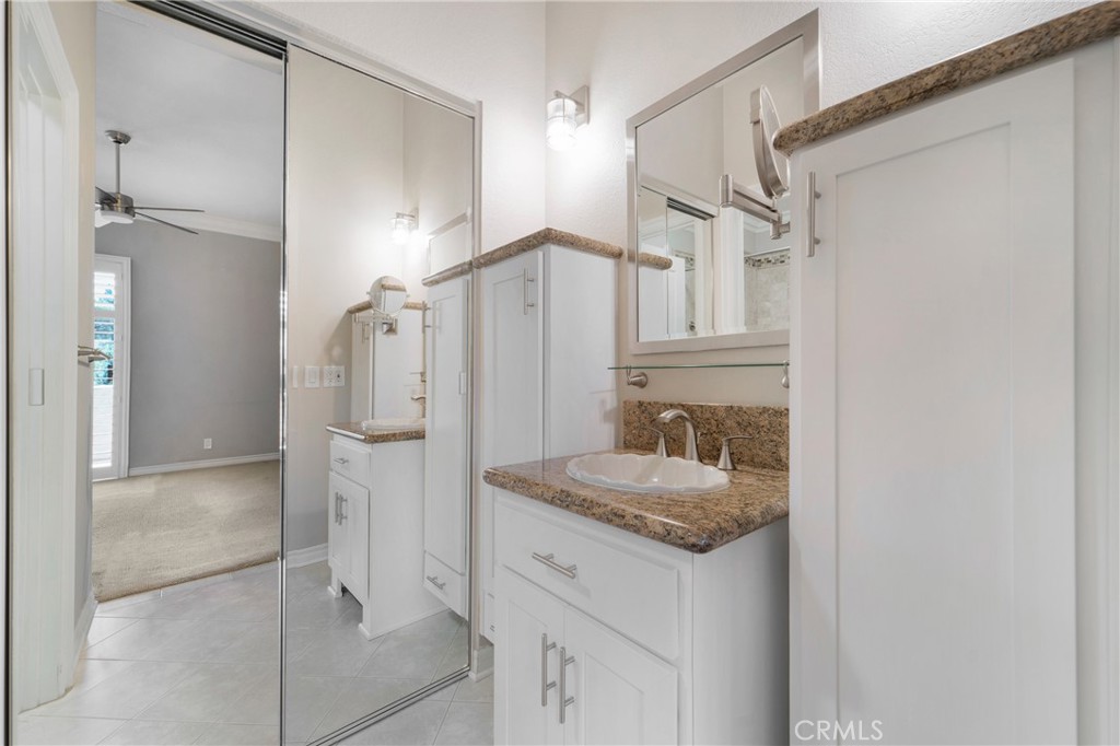 9 Sunbridge Place Dana Point, CA 92629 - Photo 18 of 21 a bathroom with a granite countertop sink mirror and shower