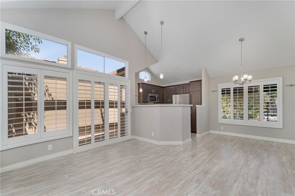 9 Sunbridge Place Dana Point, CA 92629 - Photo 4 of 21 a view of an empty room with wooden floor and a window