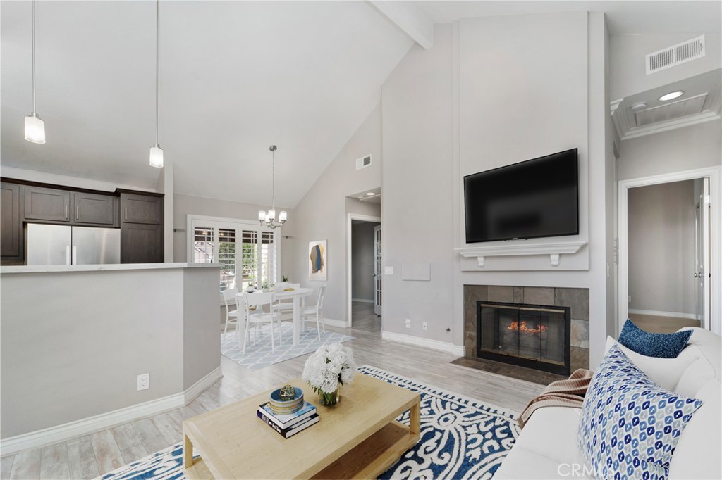 9 Sunbridge Place Dana Point, CA 92629 - Photo 8 of 21 a living room with furniture a flat screen tv and a fireplace