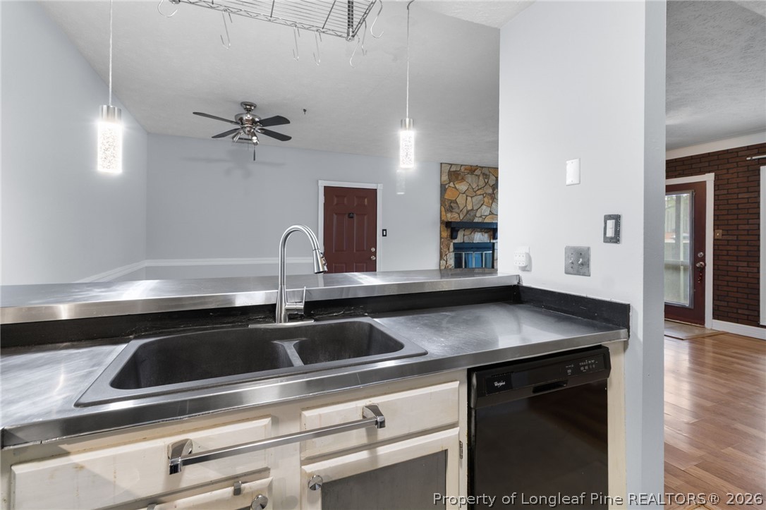1908 Tryon Drive, Unit 1 Fayetteville, NC 28303 - Photo 14 of 29 a kitchen with a sink appliances and cabinets