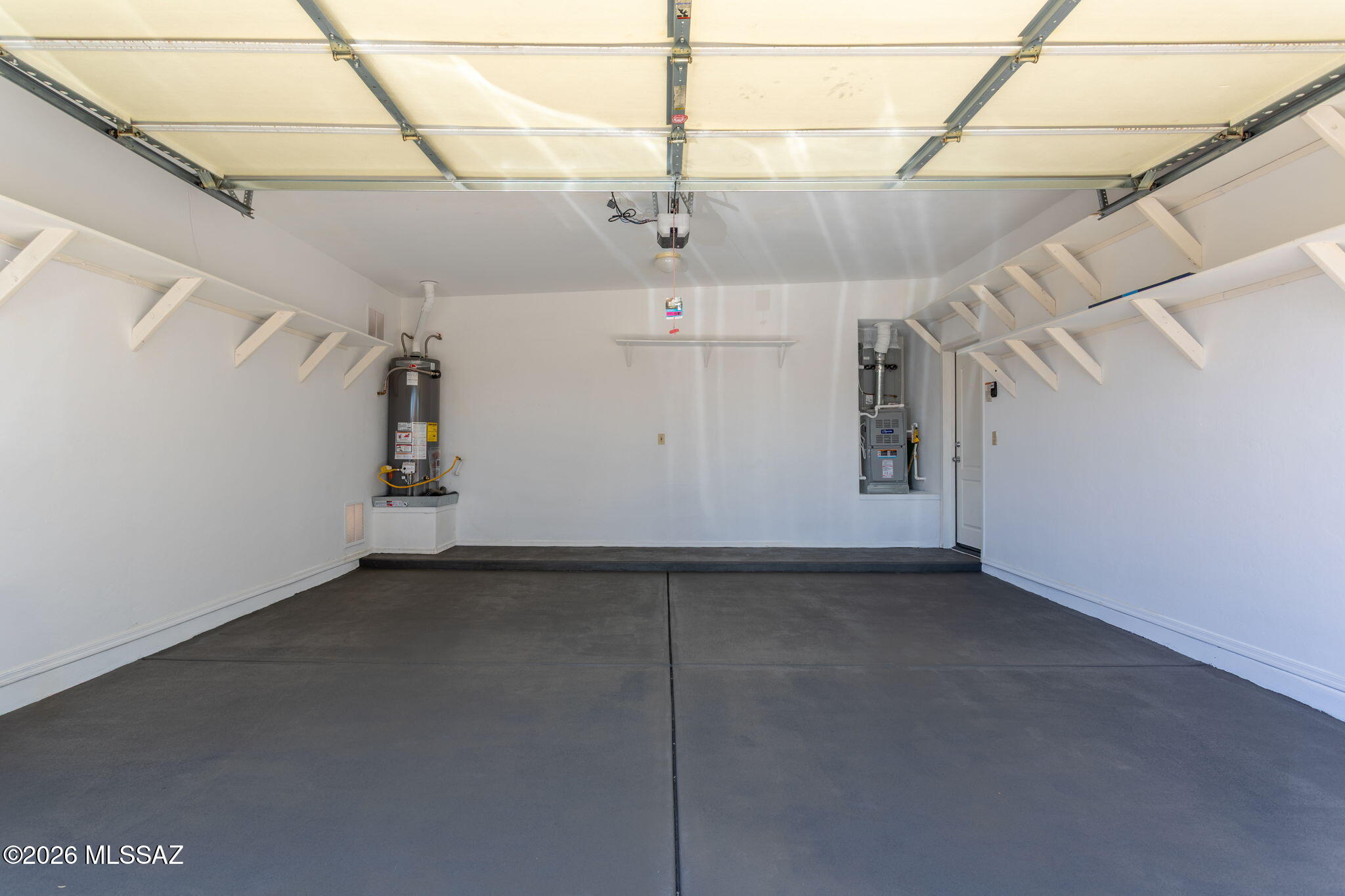 7503 West Sweet River Road Tucson, AZ 85743 - Photo 38 of 41 Plenty of Storage in this 2 Car Garage, with a New Hot Water Heater.