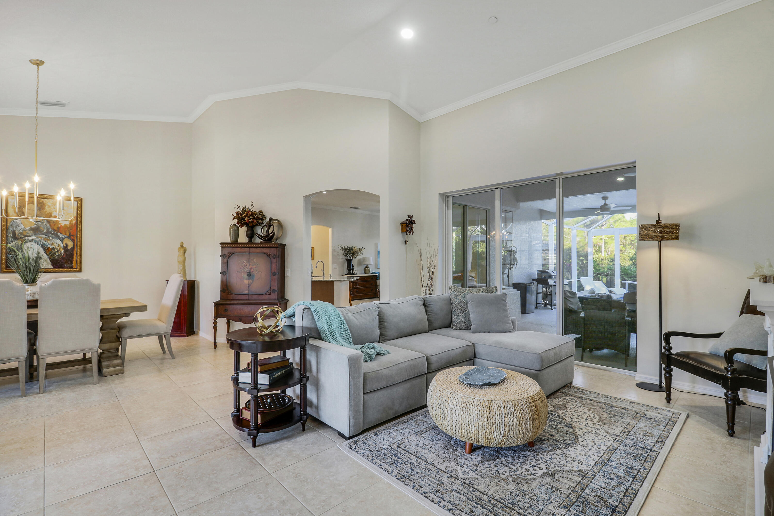 149 Southeast Ashley Oaks Way Stuart, FL 34997 - Photo 11 of 47 a living room with furniture and a large window
