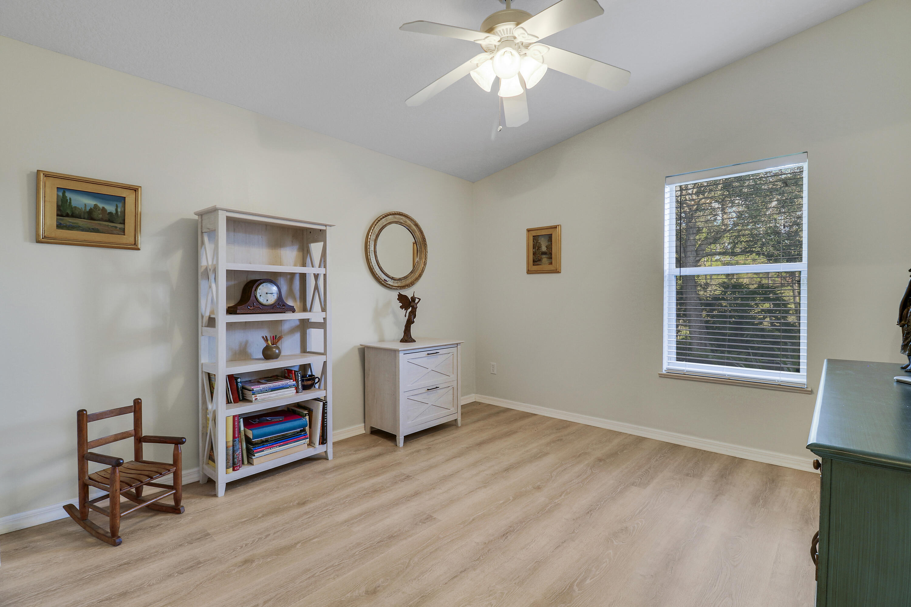 149 Southeast Ashley Oaks Way Stuart, FL 34997 - Photo 31 of 47 a view of a workspace with furniture and a window