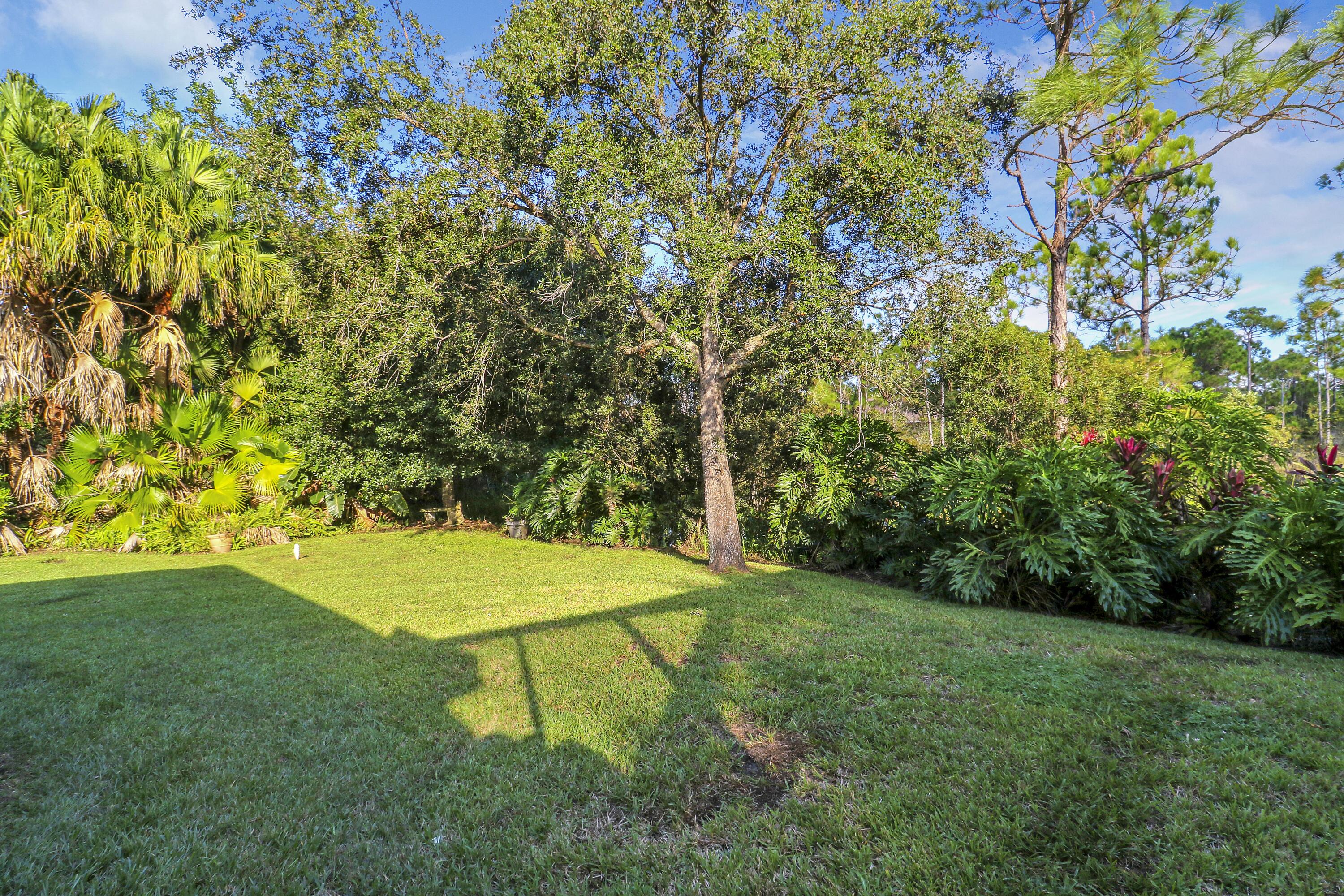 149 Southeast Ashley Oaks Way Stuart, FL 34997 - Photo 42 of 47 a view of an outdoor space and a yard