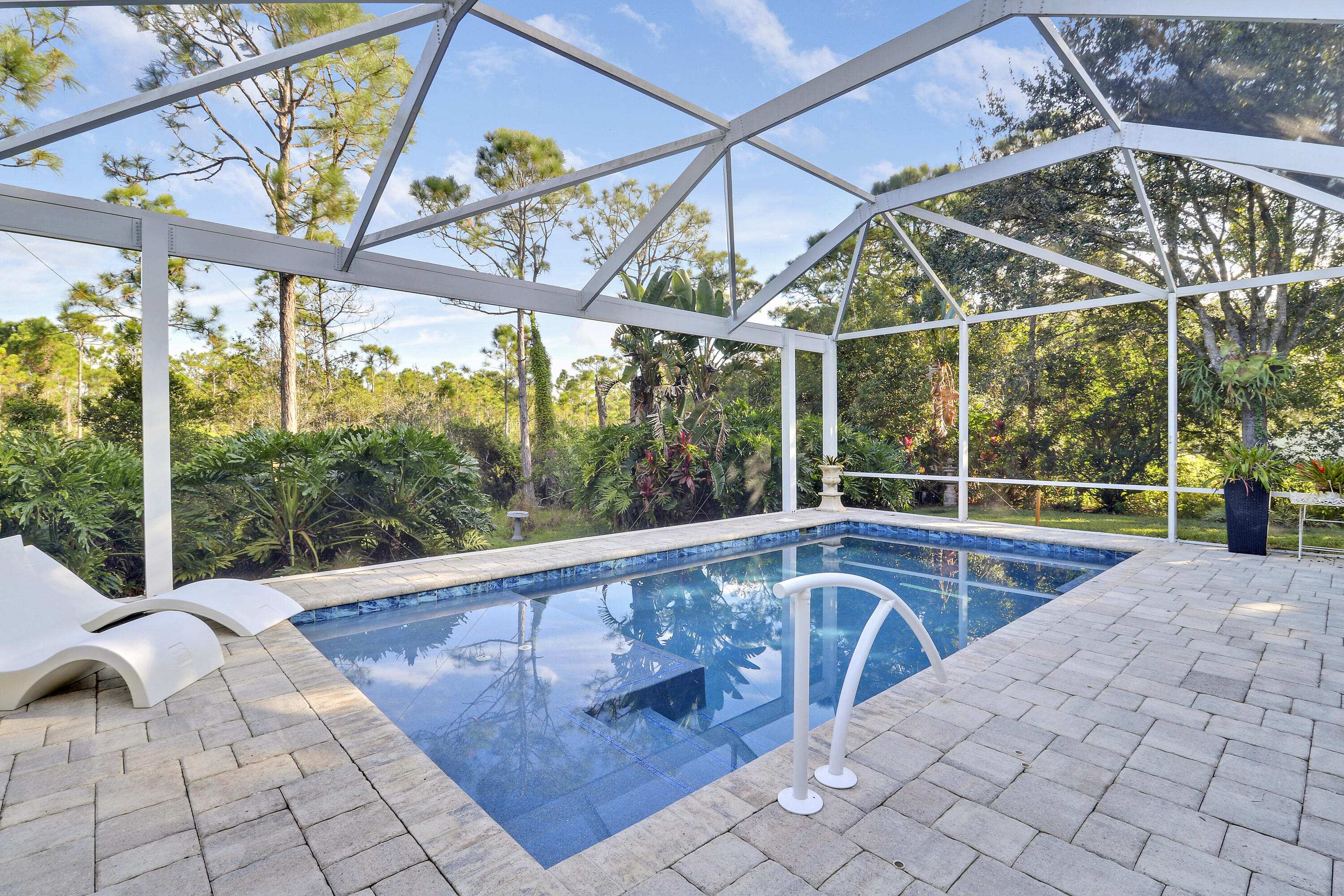 149 Southeast Ashley Oaks Way Stuart, FL 34997 - Photo 6 of 47 a view of a swimming pool with a patio