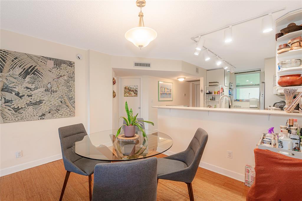 5300 Northeast 24th Terrace, Unit 512 Fort Lauderdale, FL 33308 - Photo 17 of 29 a view of a dining room with furniture and a potted plant
