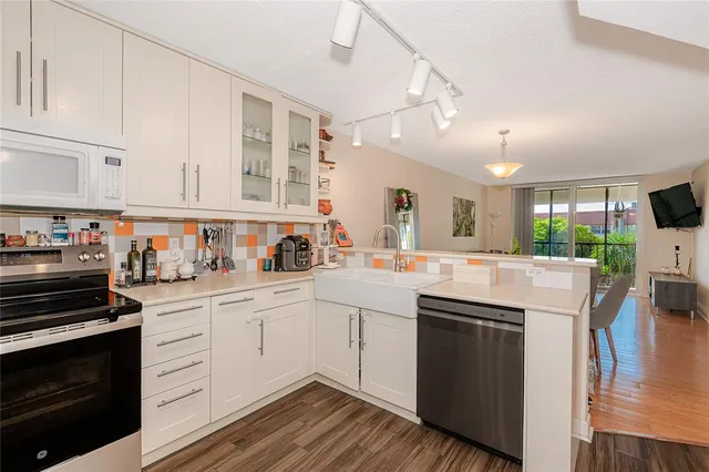 a view of a balcony with potted plants