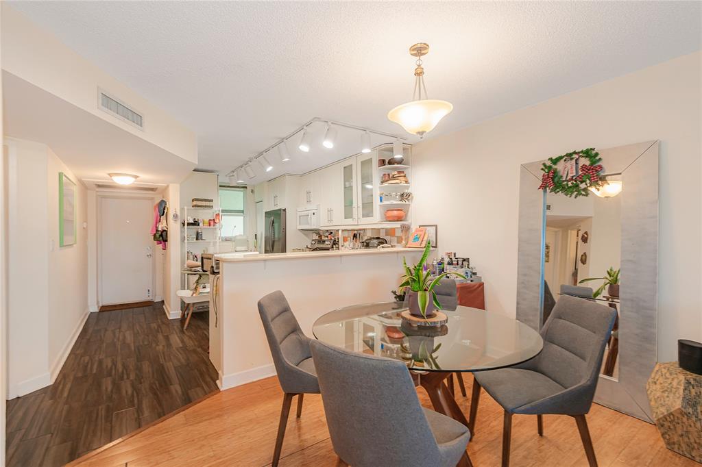 5300 Northeast 24th Terrace, Unit 512 Fort Lauderdale, FL 33308 - Photo 3 of 29 a view of a dining room with furniture and wooden floor