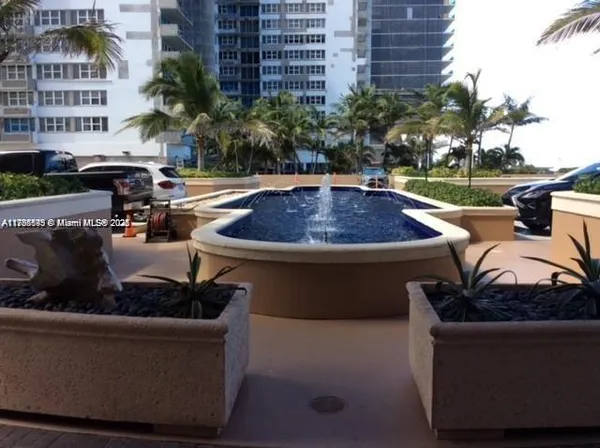 a view of outdoor sitting area with furniture and tree