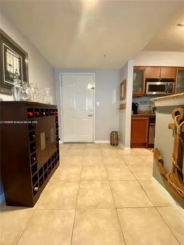 a living room with a washing machine and storage