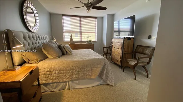 a bedroom with a bed and a mirror