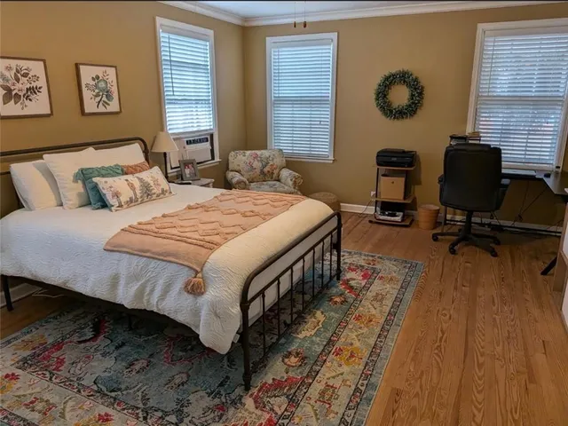 a bed room with a bed and a chair