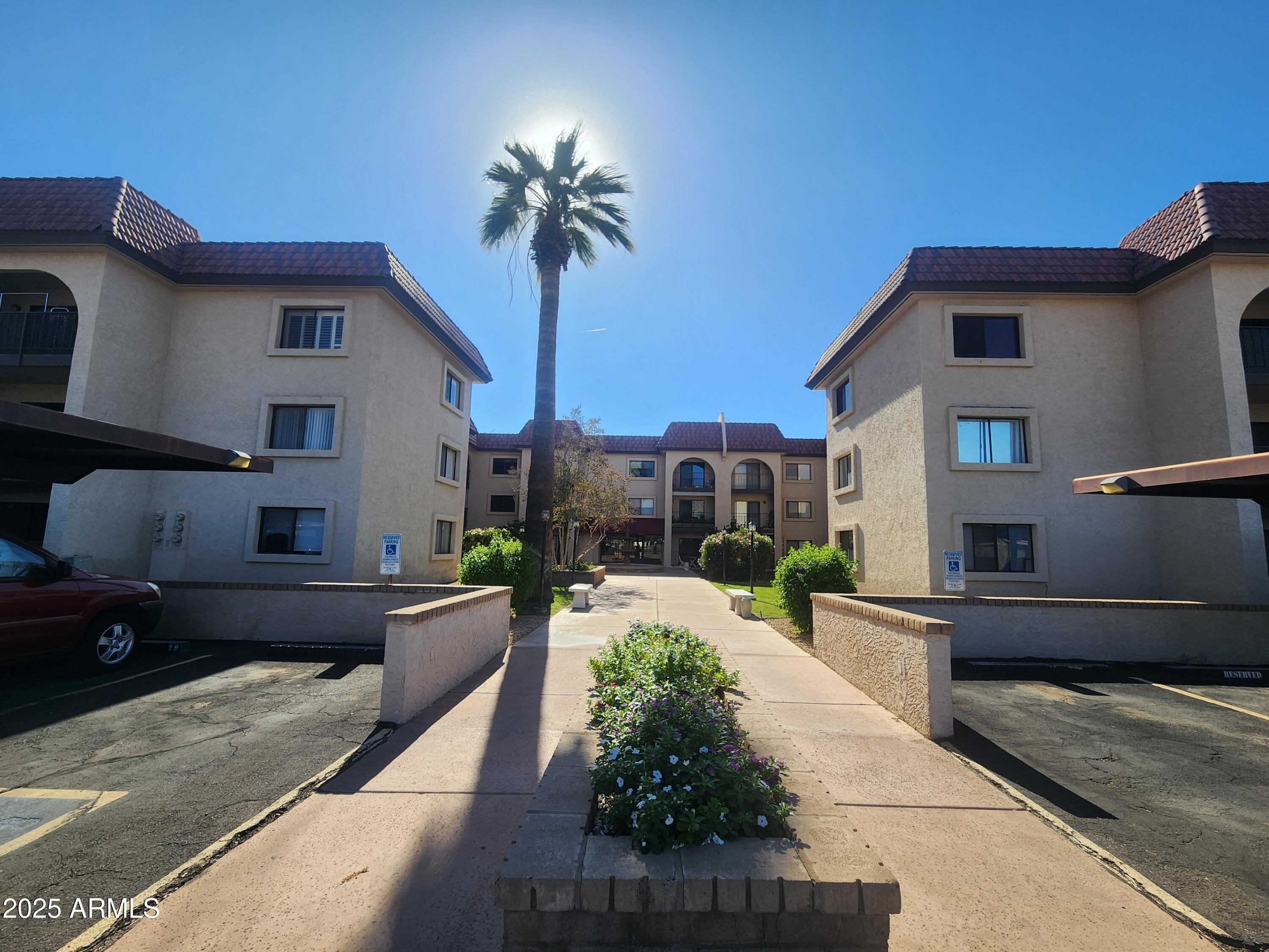 3033 East Devonshire Avenue, Unit 1028 Phoenix, AZ 85016 - Photo 1 of 27 a view of a house with a patio