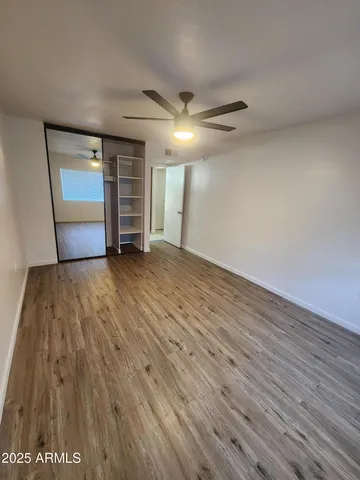 a view of an empty room and a window