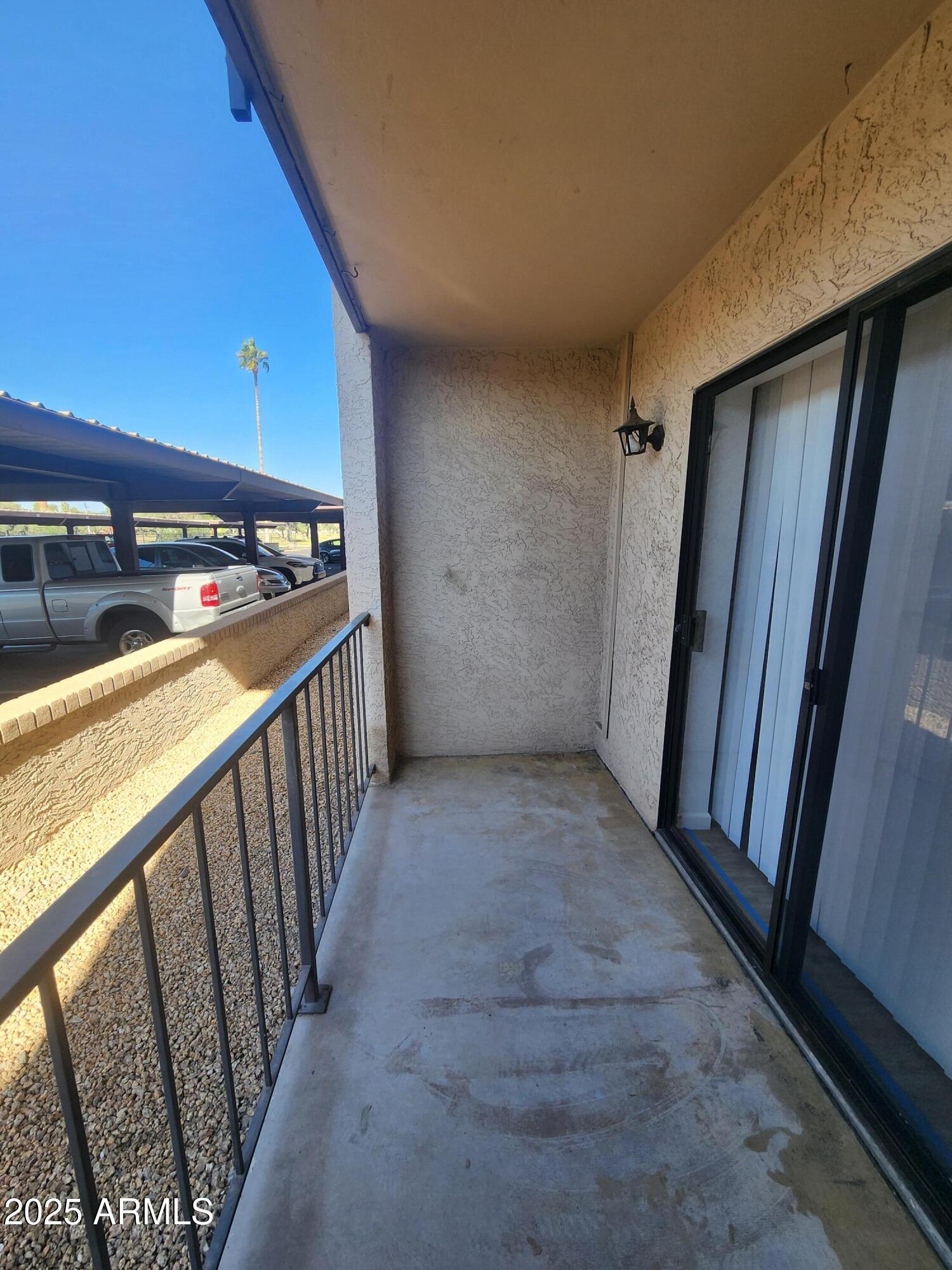 3033 East Devonshire Avenue, Unit 1028 Phoenix, AZ 85016 - Photo 14 of 27 a view of a hallway with wooden floor