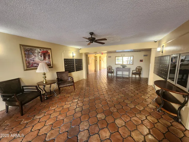 a bedroom with furniture and a large window
