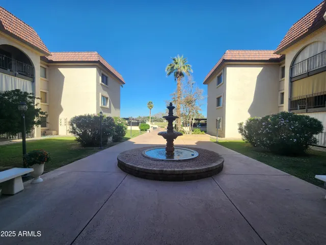 a view of a swimming pool with a yard