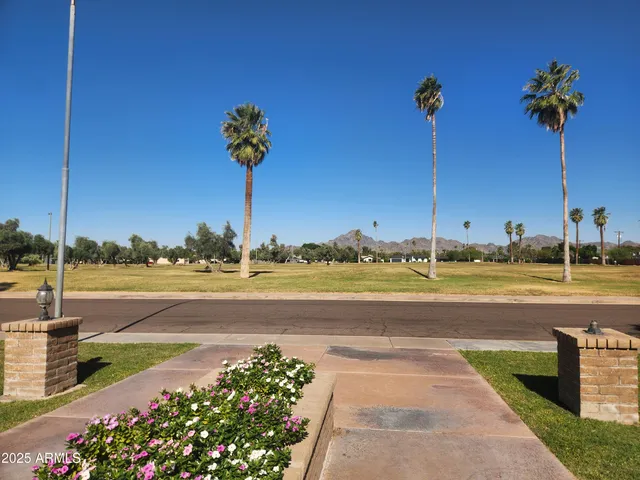 a view of a lake with a house in the background
