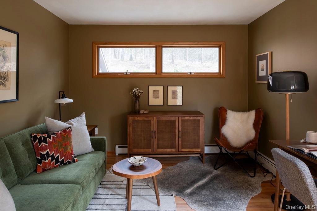 42 Lake Pleasant Road Staatsburg, NY 12580 - Photo 14 of 34 Living area with a baseboard radiator and wood finished floors