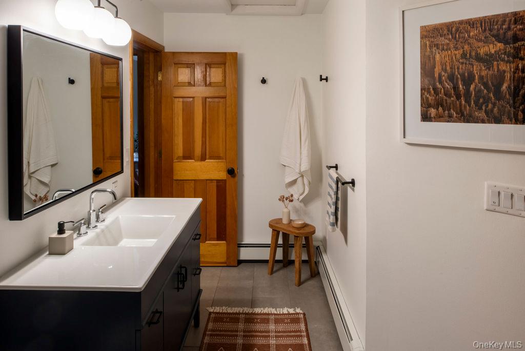 42 Lake Pleasant Road Staatsburg, NY 12580 - Photo 19 of 34 Bathroom featuring a baseboard radiator and vanity
