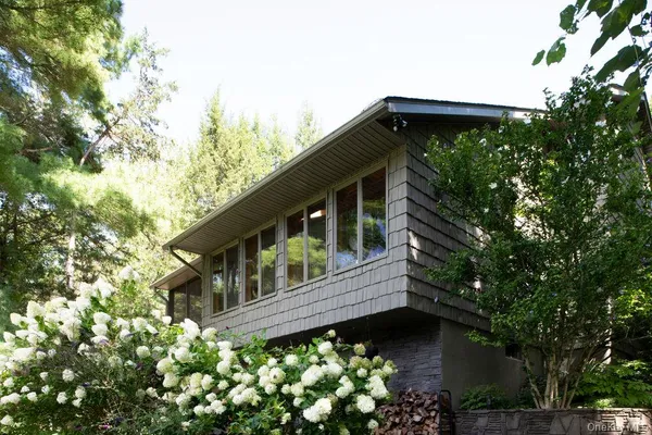 a view of a lake with houses in the back