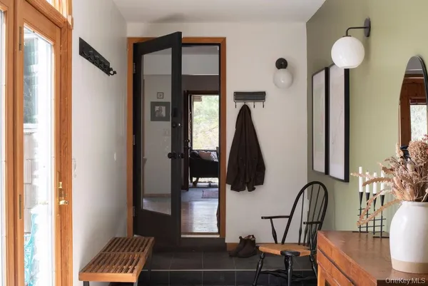 a kitchen with kitchen island stainless steel appliances a stove refrigerator and cabinets