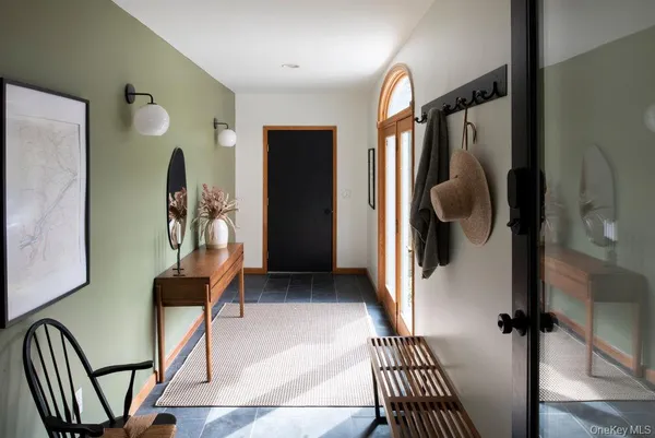 a dining room with a table and chairs