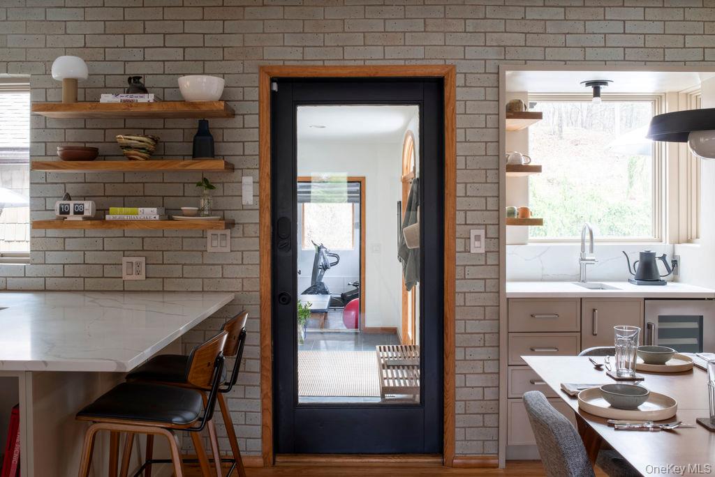42 Lake Pleasant Road Staatsburg, NY 12580 - Photo 9 of 34 Doorway to outside with wine cooler, wood finished floors, and a sink