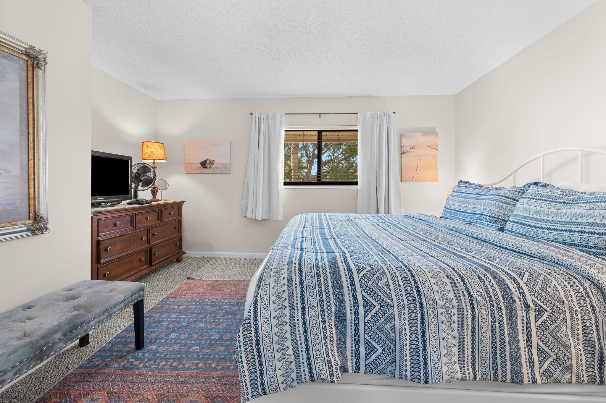 3960 A1A South, Unit 520 St. Augustine, FL 32080 - Photo 18 of 51 a bedroom with a bed and flat screen tv