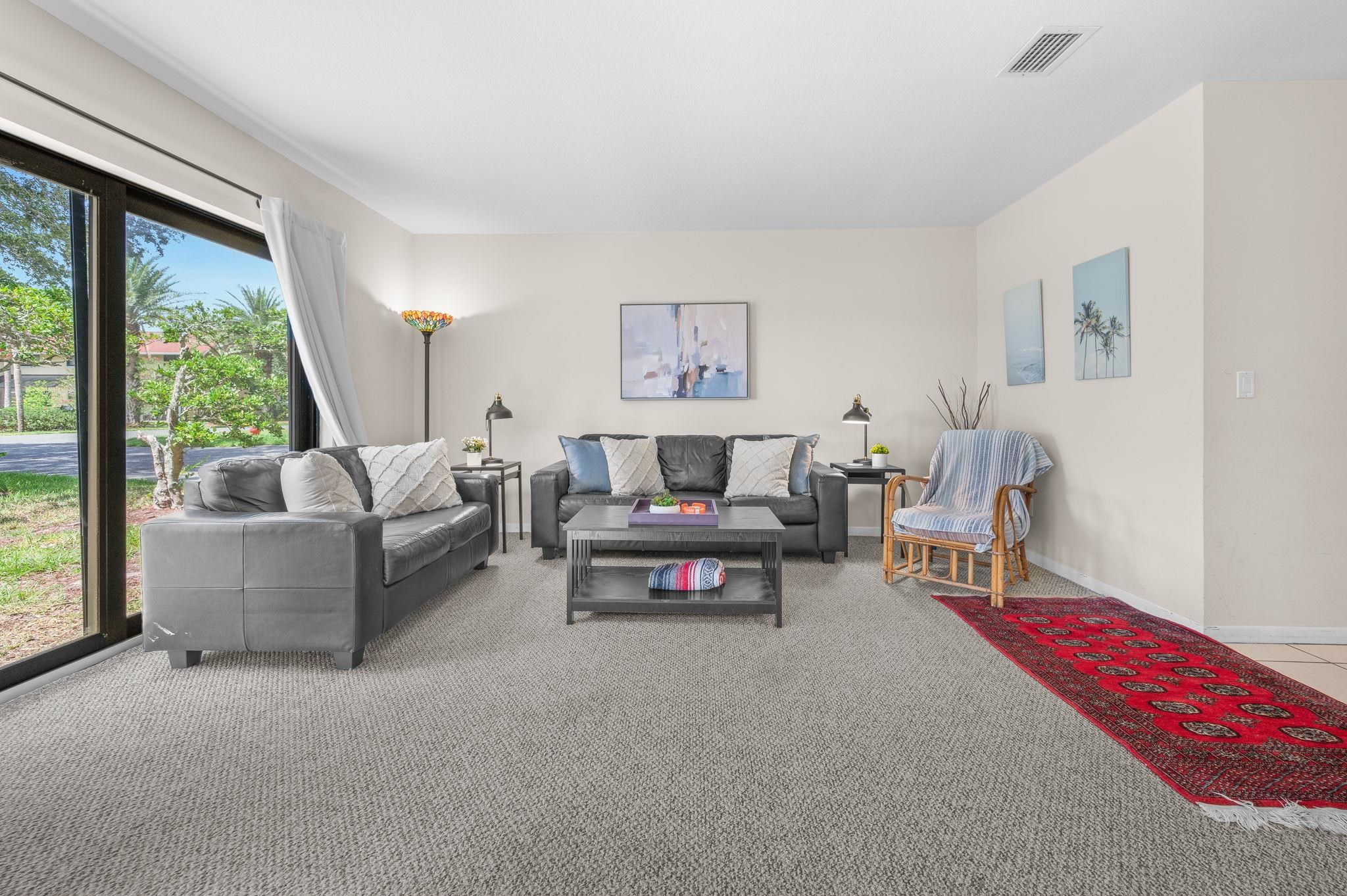 3960 A1A South, Unit 520 St. Augustine, FL 32080 - Photo 5 of 51 a living room with furniture and a large window