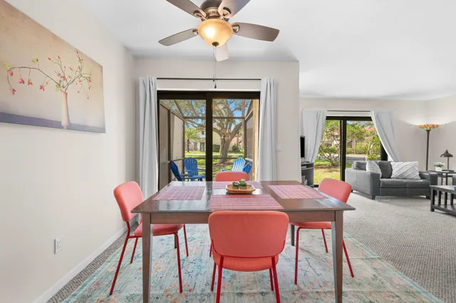 a view of a dining room with furniture window and outside view