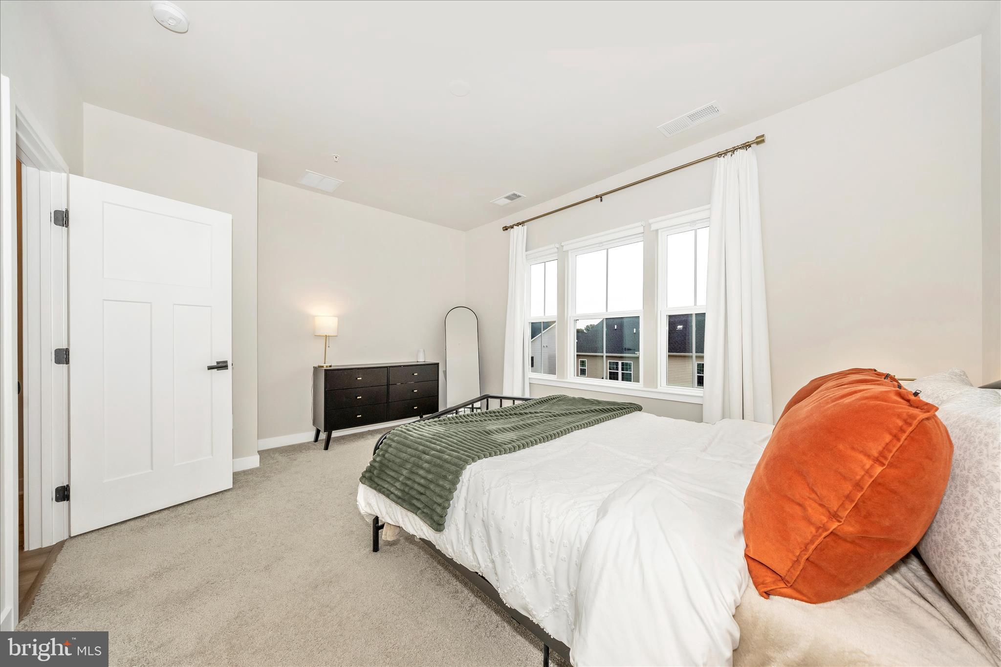 344 Patterson Park Road Frederick, MD 21703 - Photo 14 of 41 a spacious bedroom with a bed and window