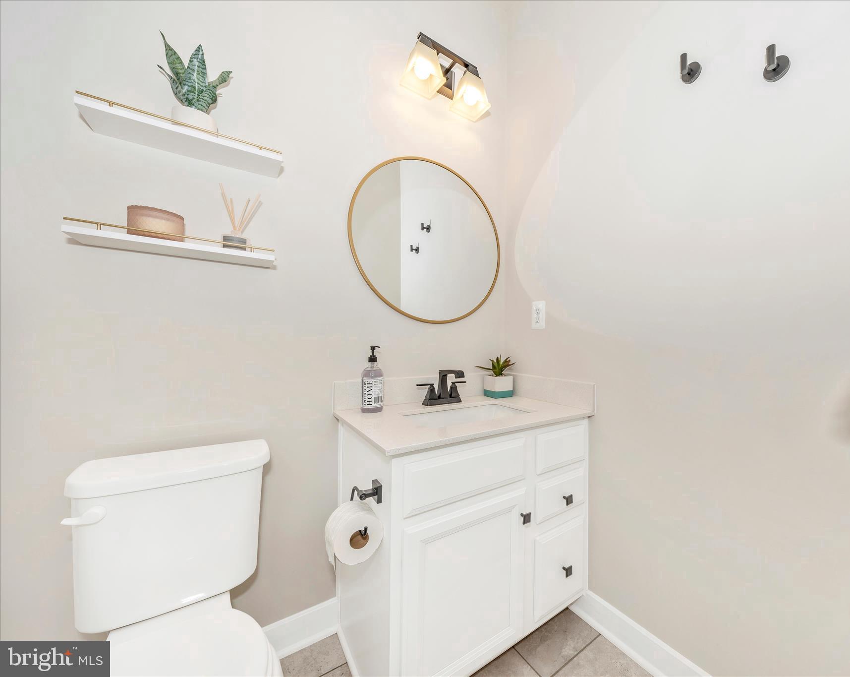 344 Patterson Park Road Frederick, MD 21703 - Photo 20 of 41 a bathroom with a toilet sink and mirror