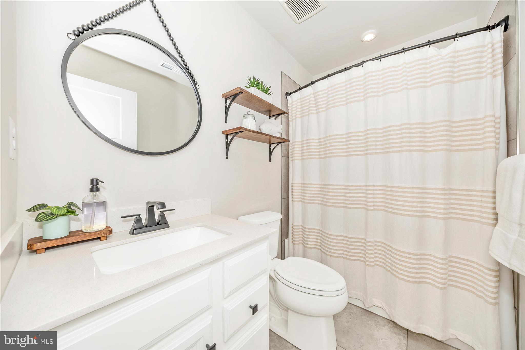 344 Patterson Park Road Frederick, MD 21703 - Photo 25 of 41 a bathroom with a sink a toilet and a mirror