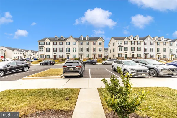 a view of a building with cars