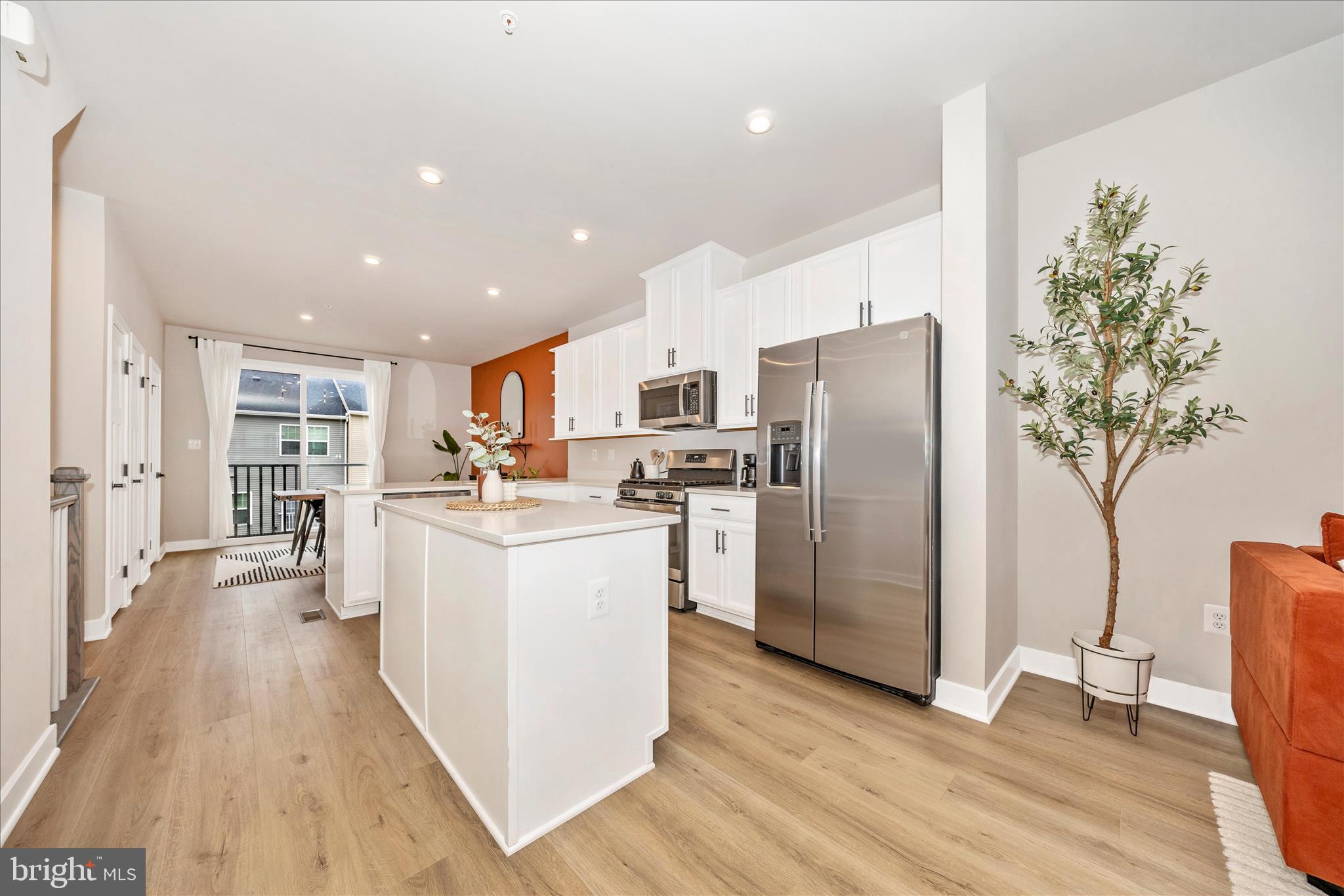 344 Patterson Park Road Frederick, MD 21703 - Photo 6 of 41 a kitchen with stainless steel appliances a refrigerator a stove a sink cabinets and wooden floor