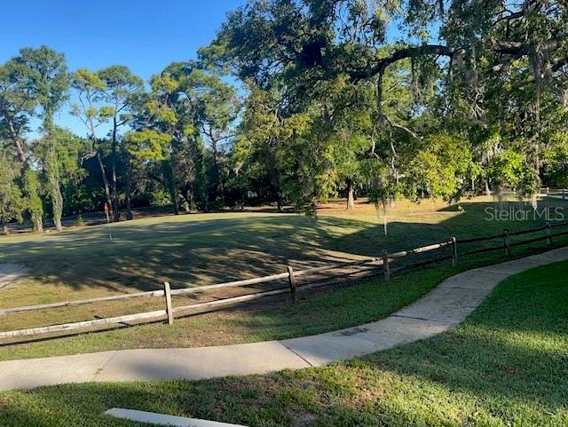 9430 Nakoma Way, Unit 12 Weeki Wachee, FL 34613 - Photo 20 of 20 a view of a park with large trees
