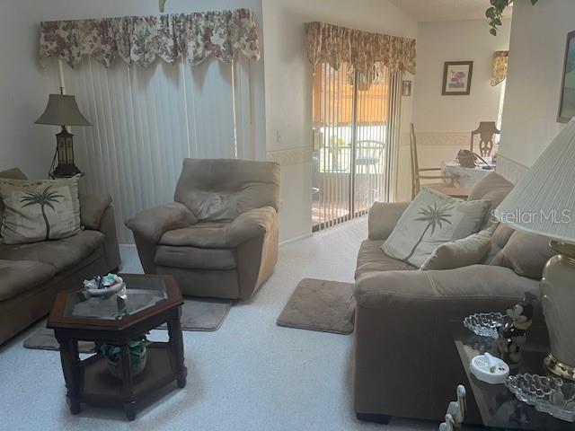 9430 Nakoma Way, Unit 12 Weeki Wachee, FL 34613 - Photo 5 of 20 a living room with furniture and a window