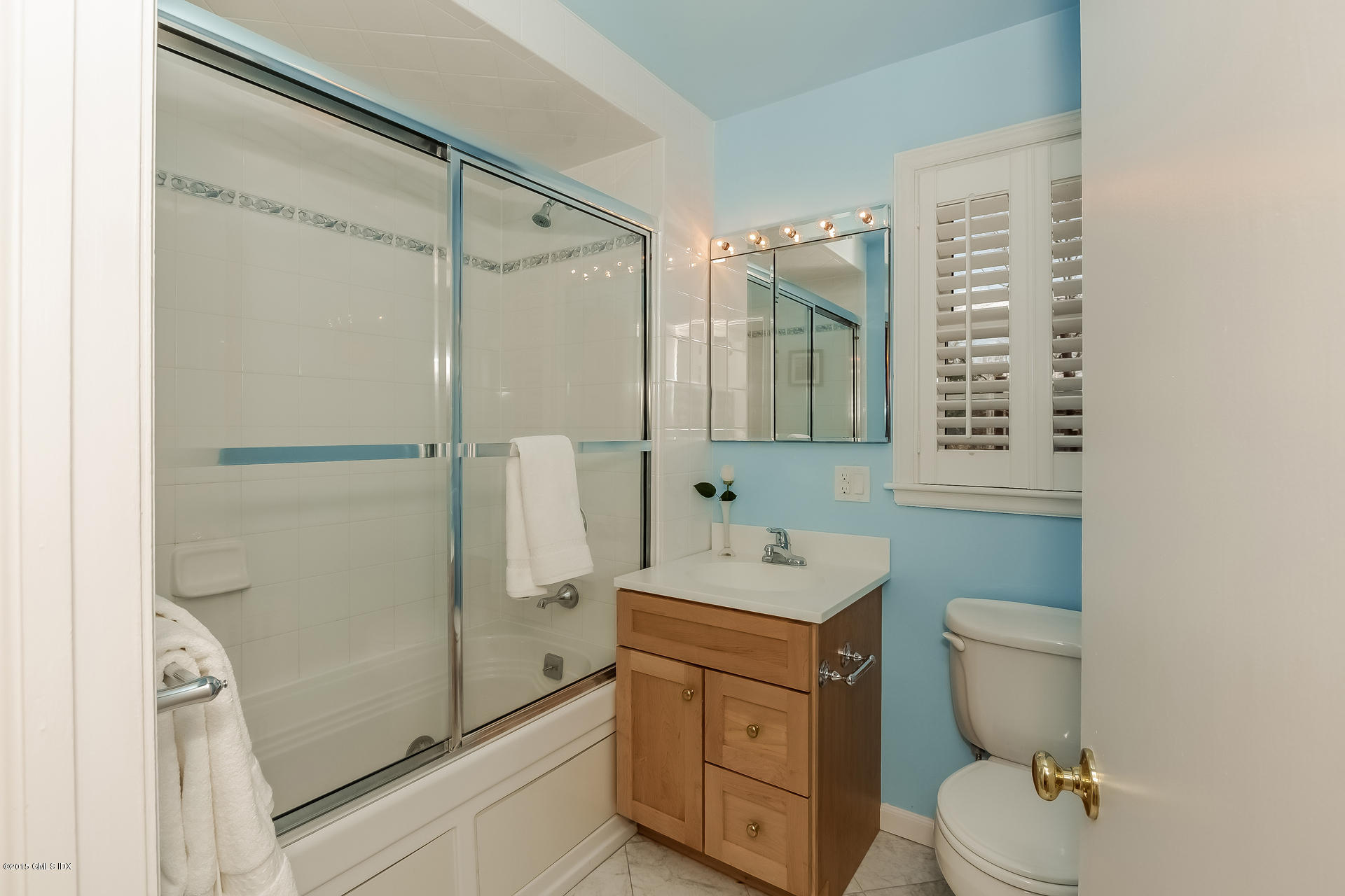 84 Cognewaugh Road Cos Cob, CT 06807 - Photo 17 of 18 a bathroom with a toilet a sink and shower