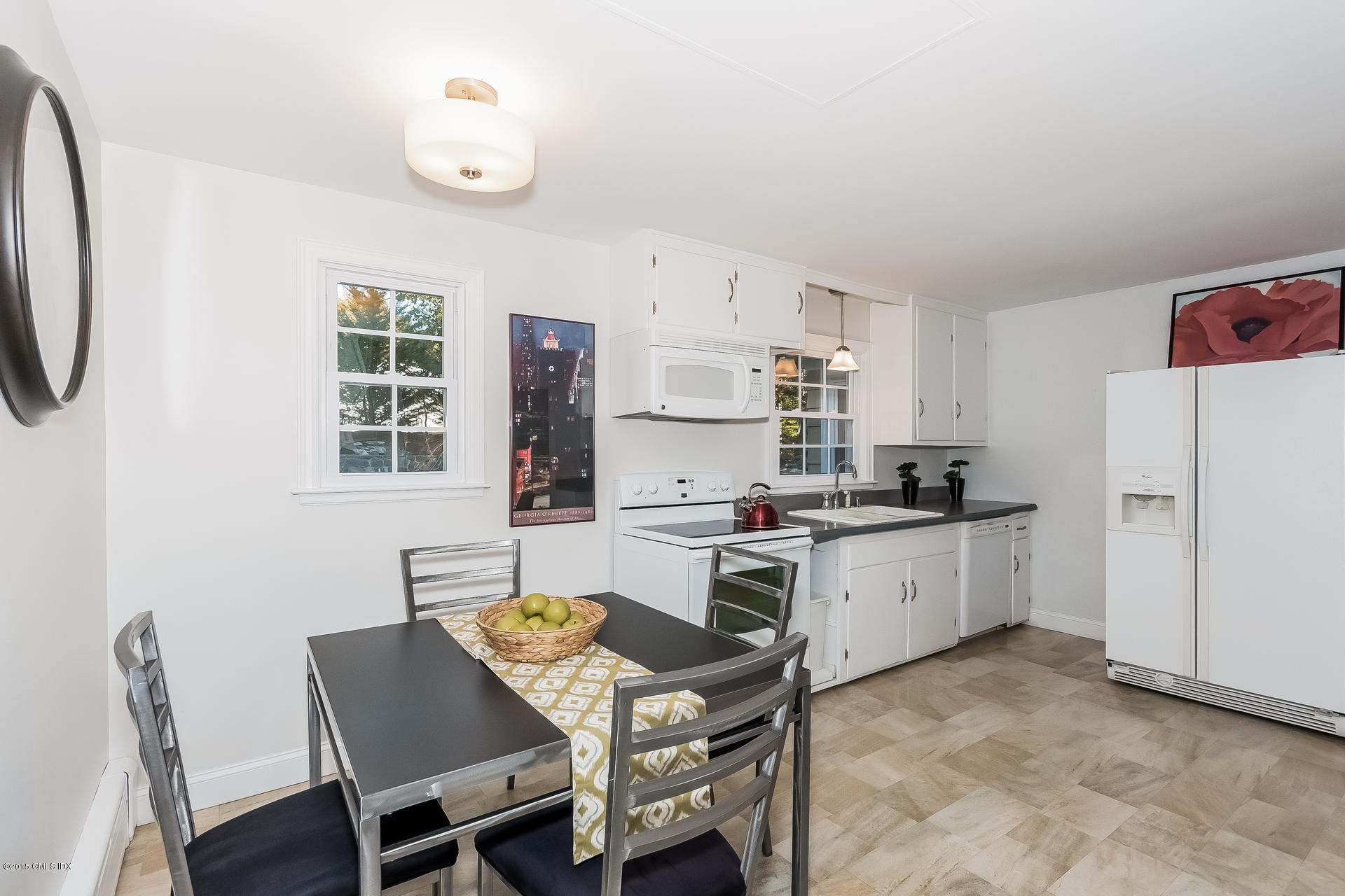 84 Cognewaugh Road Cos Cob, CT 06807 - Photo 3 of 18 a kitchen with white cabinets and white appliances