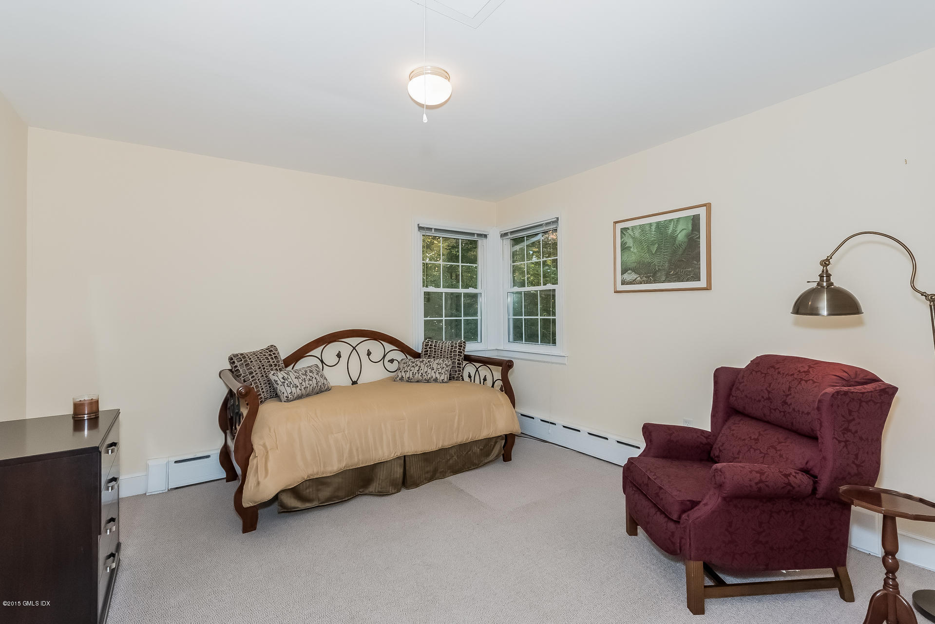 84 Cognewaugh Road Cos Cob, CT 06807 - Photo 6 of 18 a bedroom with a bed and a couch
