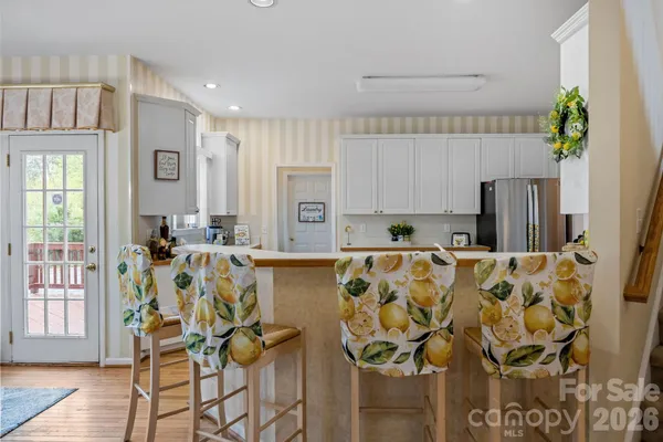 a view of kitchen with furniture and wooden floor