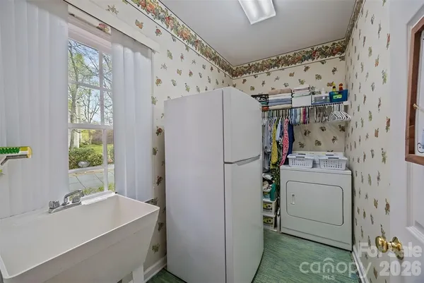a white refrigerator freezer sitting inside of a kitchen