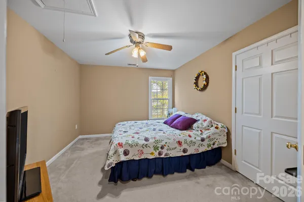 a bedroom with a bed and dresser