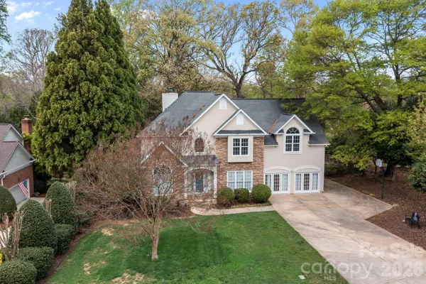 a view of house with yard